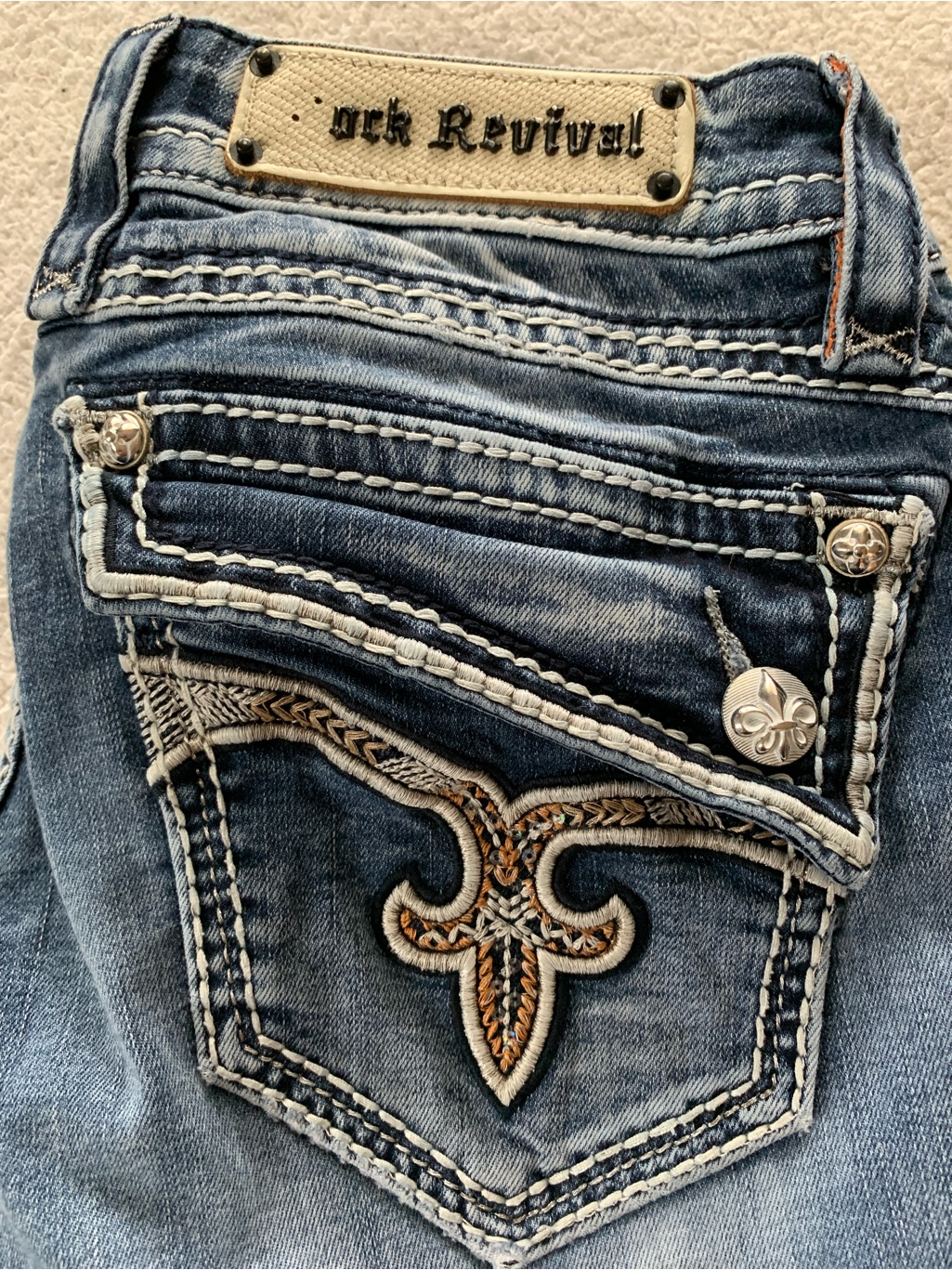 Rock Revival Women's Blue Distressed Bootcut Jeans With Embroidered Fleur-De-Lis